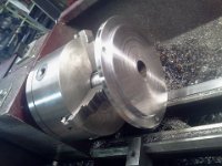 2014-11-02 14.14.48  Heated interferance fit between the tube shaft and the chuck mounting plate.  Now truing it up and turning the step.